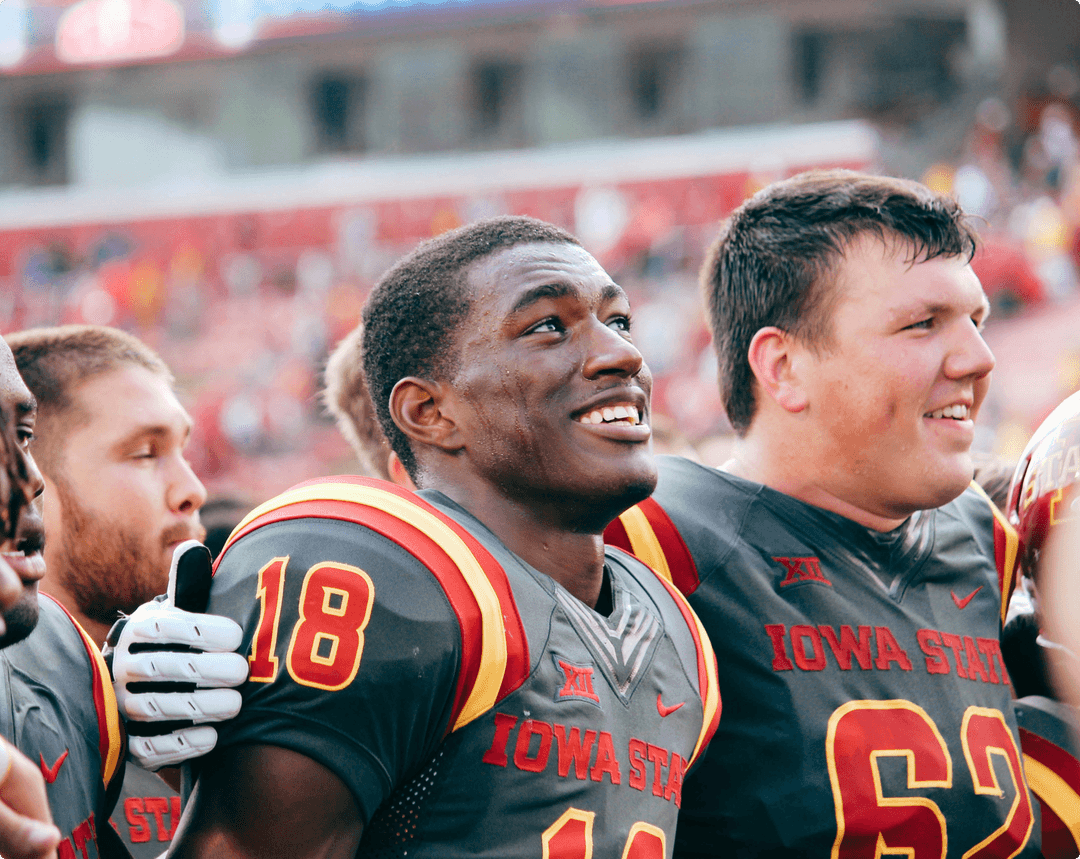 Iowa State University football players in the stadium.